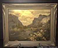 Front view of framed print under flash highlighting gold-backed effect