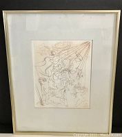 Framed artwork showing full etching within gold-tone metal frame and white mat