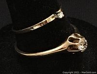 Both rings displayed stacked on black stand