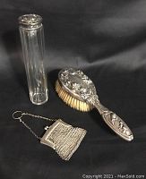 Full lot view including the brush, powder dispenser, and mesh bag.