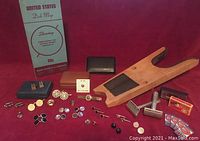 Wide view of entire lot arranged on red cloth