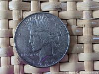Obverse front side of 1934 D Peace Dollar showing Lady Liberty with date 1934 and inscriptions.