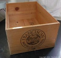 Front side view of the wooden crate showing the Franciscan Napa Valley California grape logo.