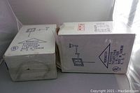 Two Remington light fixture boxes viewed horizontally, showing brand, part number 01006, origin Taiwan, UL certification.