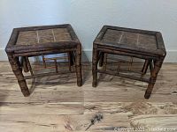Pair of Asian style bamboo motif end tables side by side, showing front and top view.