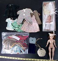 Vintage Madame Alexander doll with many handmade clothes and original box shown with measuring tape for size reference
