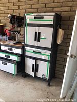 Full view of two stacked Stanley storage cabinets showing doors, drawers and overall condition.