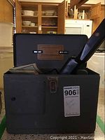 Closed open grey case with probe inside and latch visible