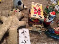Photo showing the plush mouse doll, mechanical Santa Claus in box, Santa cat figurine, sleigh with deer figures, and bird music box.