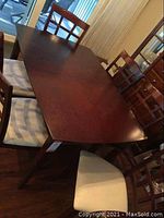 Overall view of rectangular dining table and six chairs