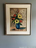 Full view of the framed floral still life painting hung on wall, showing composition and frame details.