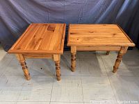 Two solid pine end tables side by side