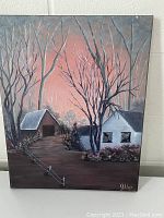 Photo of front of painting depicting a house and barn in the woods at sunset, signed by V. Alger.