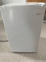 Front view of the white Maytag mini fridge showing the door and overall size.