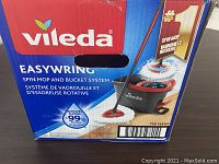 Box of Vileda EasyWring Spin Mop and Bucket showing product exterior and branding.