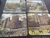 Photo showing all four Marlborough table mats laid out displaying English castle and countryside scenes