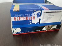 Close-up photo of blue CD cases with Beethoven's profile and volume numbers 44 and 86 visible, placed inside original box with Beethoven portrait and text.