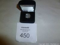 Photo of vintage Freemason men's ring in black velvet box showing front face and box.