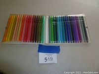 Set of 36 fine point color pens arranged in two rows in a clear plastic folding case, showing wide color range including yellows, reds, greens, and blues.