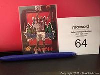 Photo of Kevin Garnett basketball trading card in protective sleeve with red background and Timberwolves logo.