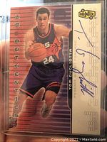 Full front view of Tom Gugliotta 1999 UD Authentics Ionix basketball card showing image and autograph.