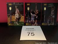Three signed rookie basketball cards displayed upright: Tyrone Corbin, Terry Davis, and Billy McCaffrey.