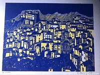 Close-up image of the artwork showing the village scene with buildings in blue and yellow, with visible texture and line work.