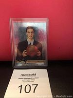 Glossy basketball card showing Pau Gasol in a suit holding a basketball with Topps Stadium Club branding.