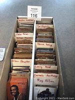 Top view of two box sections filled with trading cards sorted by player name with dividers