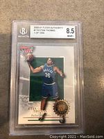 2000-01 Fleer Authority #119 Etan Thomas card in Beckett slab graded 8.5
