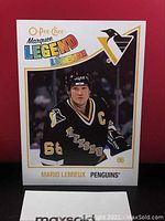 Close-up front view of Mario Lemieux hockey card showing O-Pee-Chee Marquee Legend branding, Penguins logo, player photo and number 66.