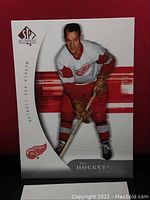 Close-up photo of Gordie Howe hockey card in Detroit Red Wings uniform from SP Authentic series.