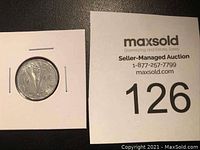 Photo of 1944 Canadian nickel with auction number card