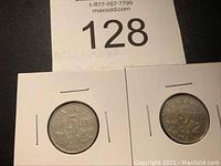 Two Canadian nickels dated 1924 and 1927 in protective white holders with lot number above