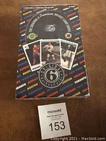 Sealed black box of Original 6 hockey cards with colorful team city names and three player cards shown on front.