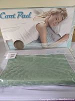 Shield Life Cool Pad box with image of a woman lying on the cooling pad and the product name and highlights.