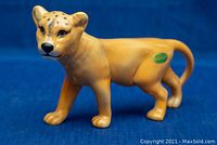 Front-side view showing the tigress face, body details and Beswick England green sticker on the rear.
