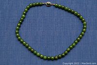 Full view of the 17.5-inch green glass bead necklace