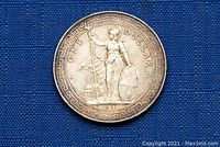 Obverse side of the 1911 Hong Kong silver one dollar coin featuring Britannia standing with trident and shield, with inscriptions.