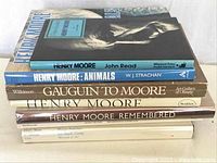 Stack of 7 hardcover and softcover Henry Moore art books showing titles and publishers on spines.