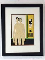 Framed lithograph print of two nude female figures with a colorful geometric background.
