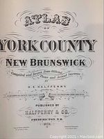 Close-up photo of a detailed title page for York County New Brunswick from the atlas, indicating it was compiled and drawn by H.E. Halfpenny in 1878 and published by Halfpenny & Co.