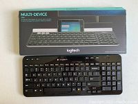 Photo of Logitech K780 keyboard with packaging box displayed on a white surface.