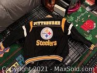 Front view of black Pittsburgh Steelers coat with logo and text on front.