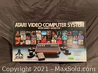 Original Atari Video Computer System box with console and controllers