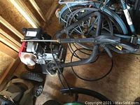 Top-down view showing washer unit, frame, hose and wand