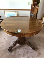 Assembled oval table showing full top and base