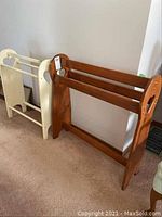 Two wooden quilt racks side by side showing overall condition and design.