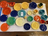 Overhead view of all Fiesta pieces on white cloth