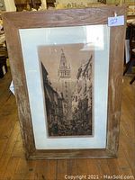 Full view of framed engraving with wood frame and white mat.